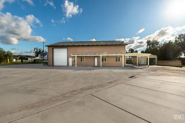 a kitchen with a sink a stove and cabinets