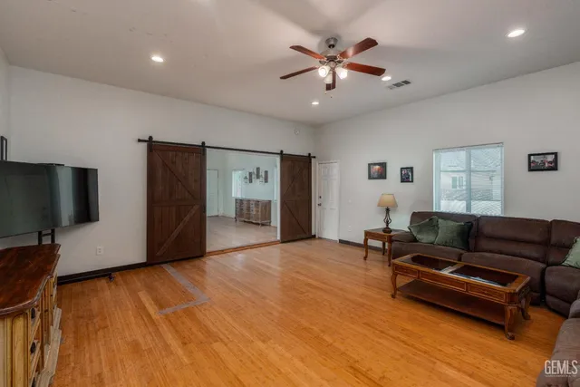 a white toilet sitting next to a bath tub