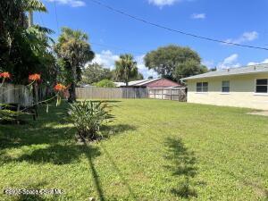 317 3rd Avenue Indialantic, FL 32903 - Photo 3 of 18 a view of a house with a big yard