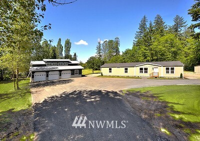 16029 Gibson Road Southwest Tenino, WA 98589 - Photo 1 of 35 a view of a house with a yard