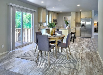 16029 Gibson Road Southwest Tenino, WA 98589 - Photo 14 of 35 a view of a dining room with furniture a rug and wooden floor