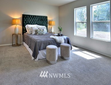 16029 Gibson Road Southwest Tenino, WA 98589 - Photo 15 of 35 a bedroom with a bed and window