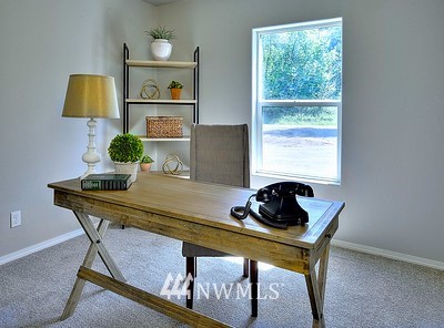 16029 Gibson Road Southwest Tenino, WA 98589 - Photo 20 of 35 a living room with furniture and a window