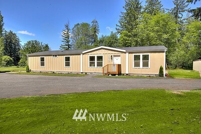 16029 Gibson Road Southwest Tenino, WA 98589 - Photo 2 of 35 a front view of a house with a yard