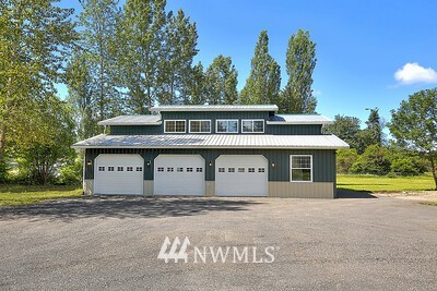 16029 Gibson Road Southwest Tenino, WA 98589 - Photo 3 of 35 a front view of a house with a garden