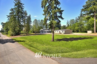 16029 Gibson Road Southwest Tenino, WA 98589 - Photo 5 of 35 a view of a park with swings and slides
