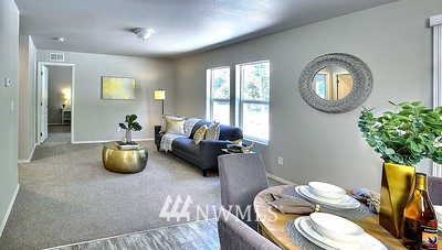 16029 Gibson Road Southwest Tenino, WA 98589 - Photo 8 of 35 a living room with furniture and a potted plant