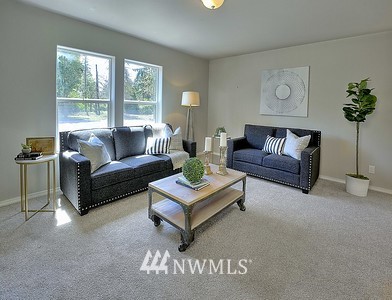 16029 Gibson Road Southwest Tenino, WA 98589 - Photo 10 of 35 a living room with furniture and a large window