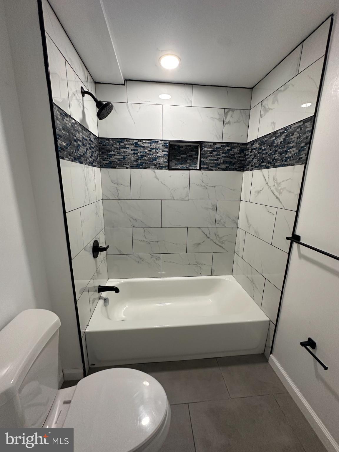 1927 Druid Hill Avenue Baltimore, MD 21217 - Photo 7 of 10 a bathroom with a bathtub a toilet and a shower