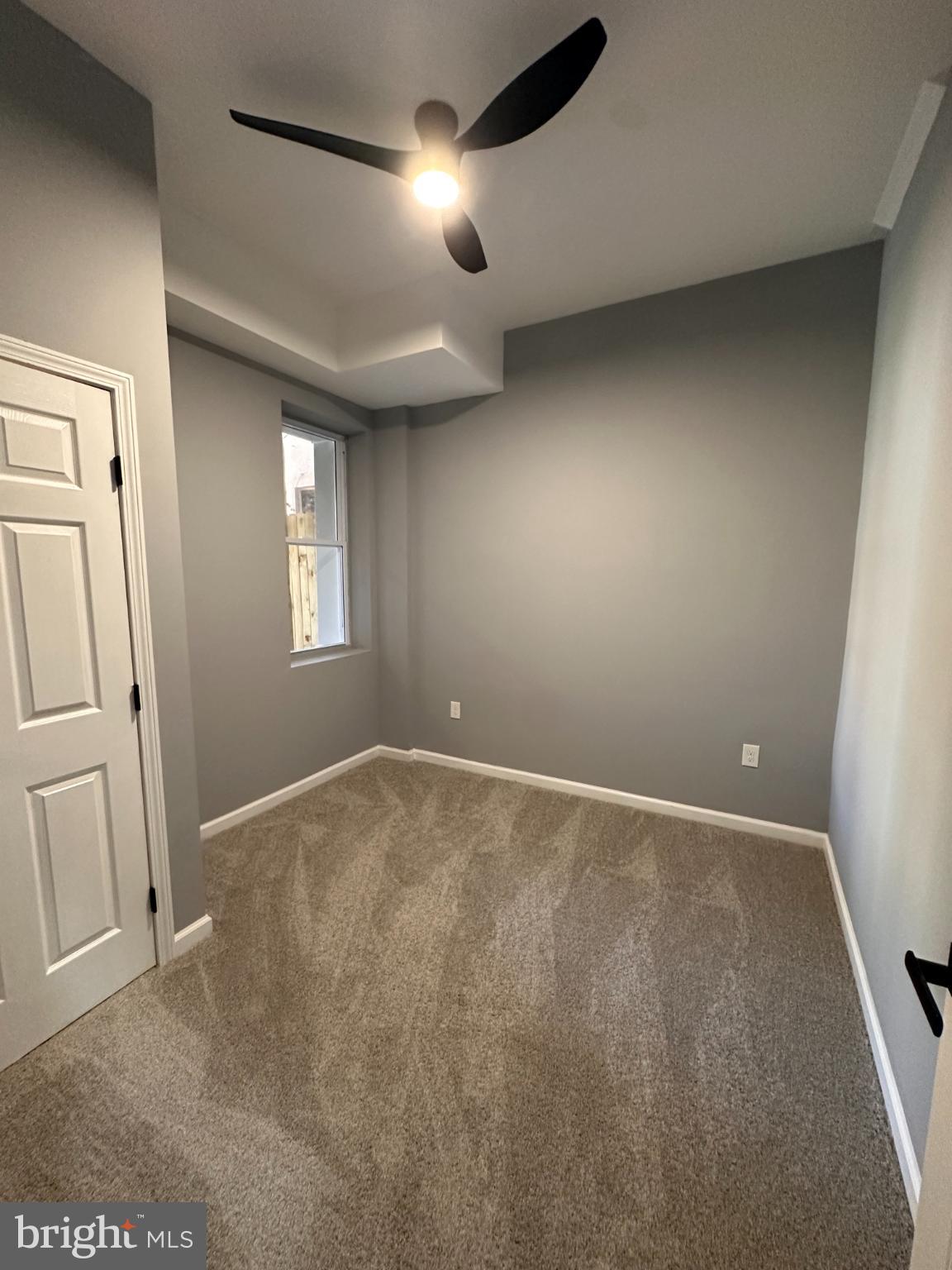 1927 Druid Hill Avenue Baltimore, MD 21217 - Photo 9 of 10 an empty room with windows and closet
