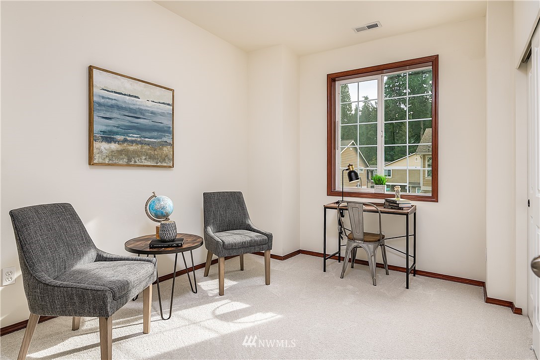 1043 215th Place Southeast Bothell, WA 98021 - Photo 12 of 29 a workspace with furniture and a window