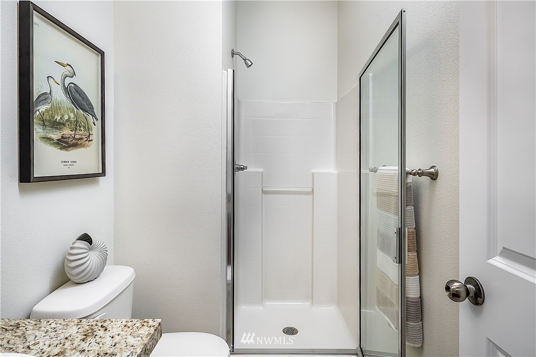 1043 215th Place Southeast Bothell, WA 98021 - Photo 13 of 29 a bathroom with a toilet and shower