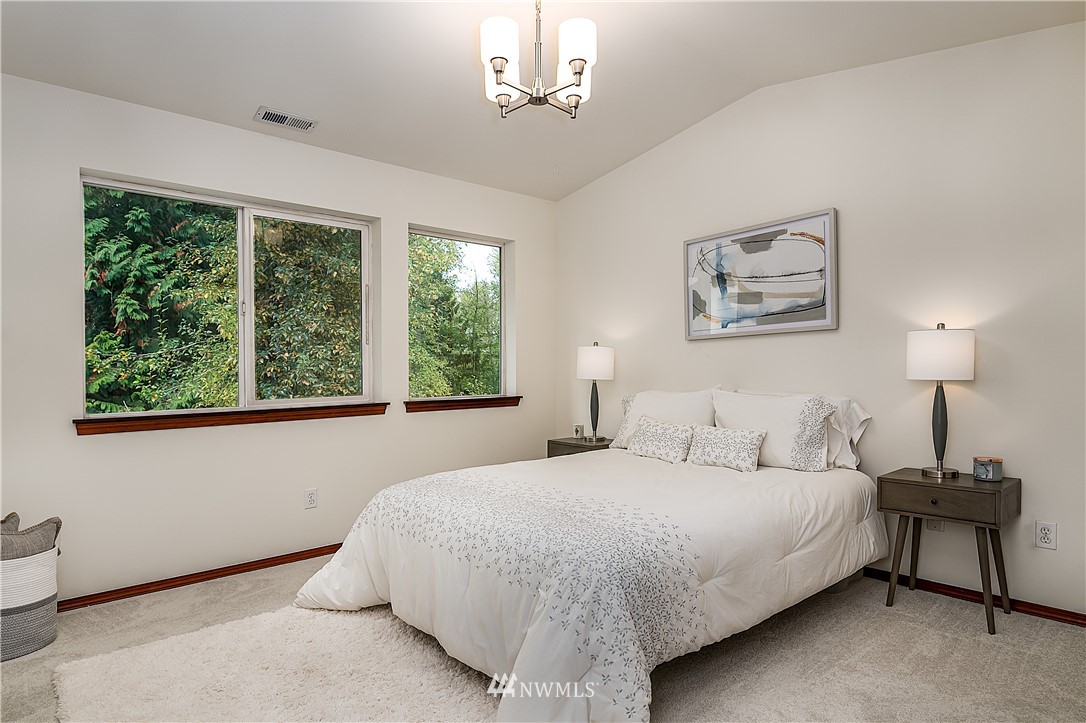 1043 215th Place Southeast Bothell, WA 98021 - Photo 16 of 29 a bedroom with a bed painting and window