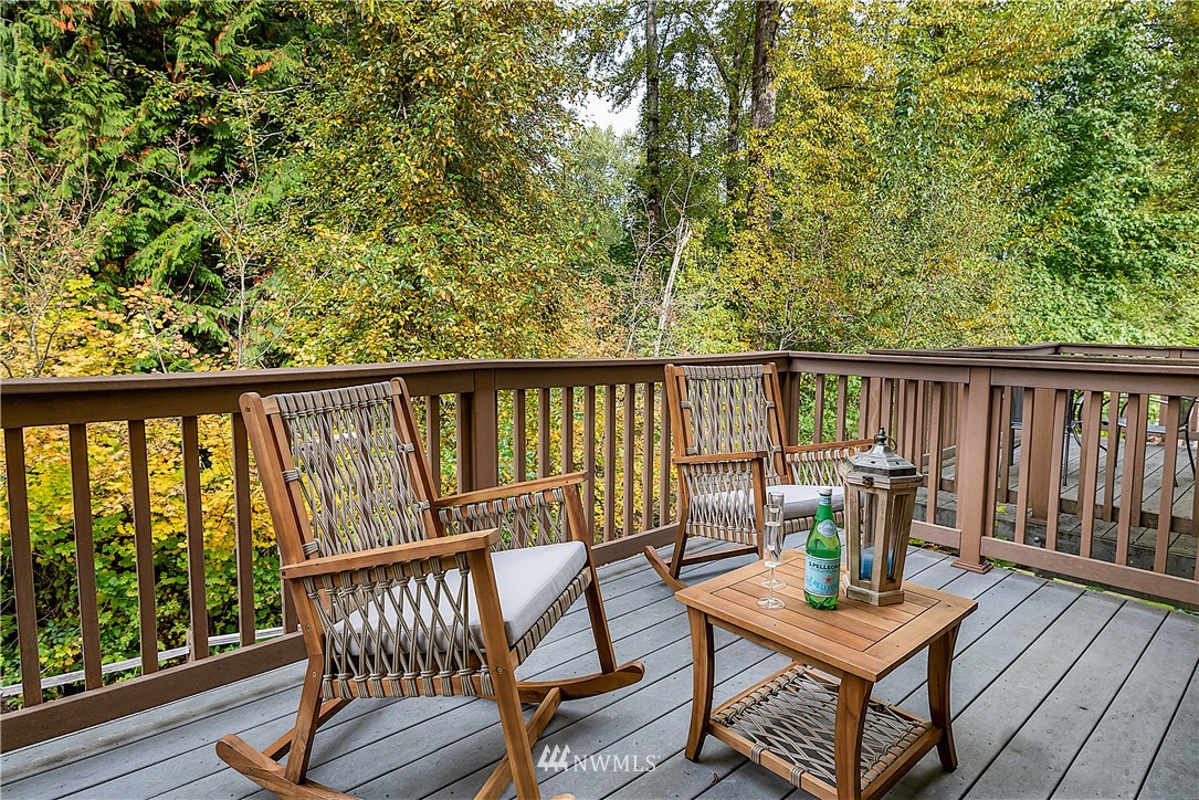 1043 215th Place Southeast Bothell, WA 98021 - Photo 5 of 29 a view of balcony with furniture and wooden deck