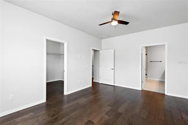a view of an empty room and wooden floor