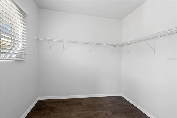 a view of an empty walk in closet