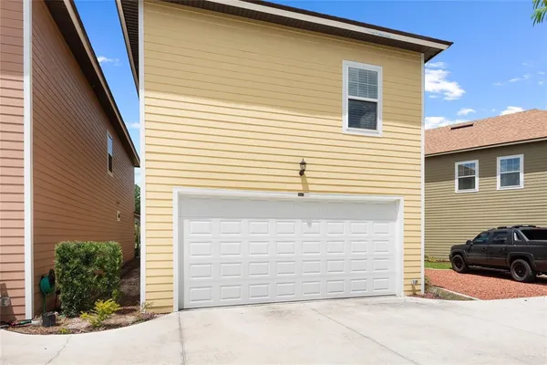 a view of a house with parking space