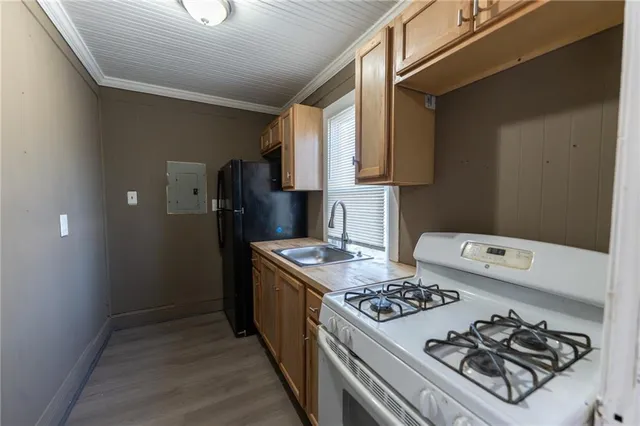 a kitchen with a stove a refrigerator and a stove