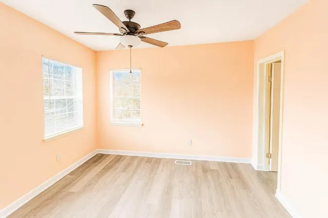 a view of an empty room and a window