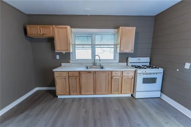 a kitchen with a sink and cabinets