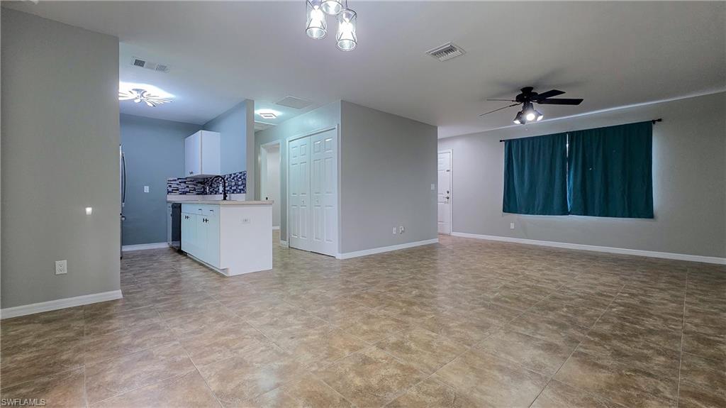 7319 Albany Road Fort Myers, FL 33967 - Photo 6 of 27 a view of a kitchen with a sink and a refrigerator