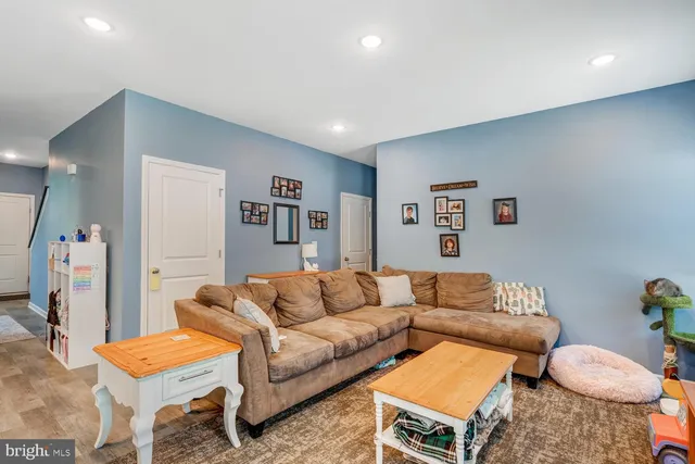 a living room with furniture and a white couch