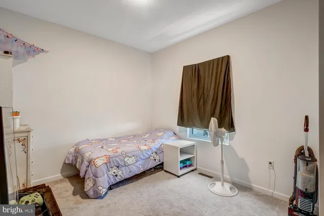 a bedroom with a bed and a closet