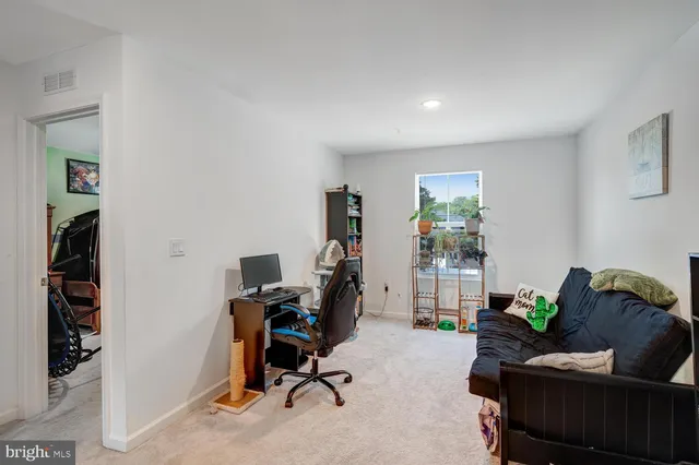 a view of a workspace with furniture and toys