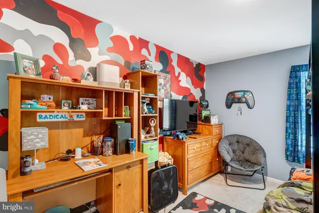 a room with furniture and musical instruments