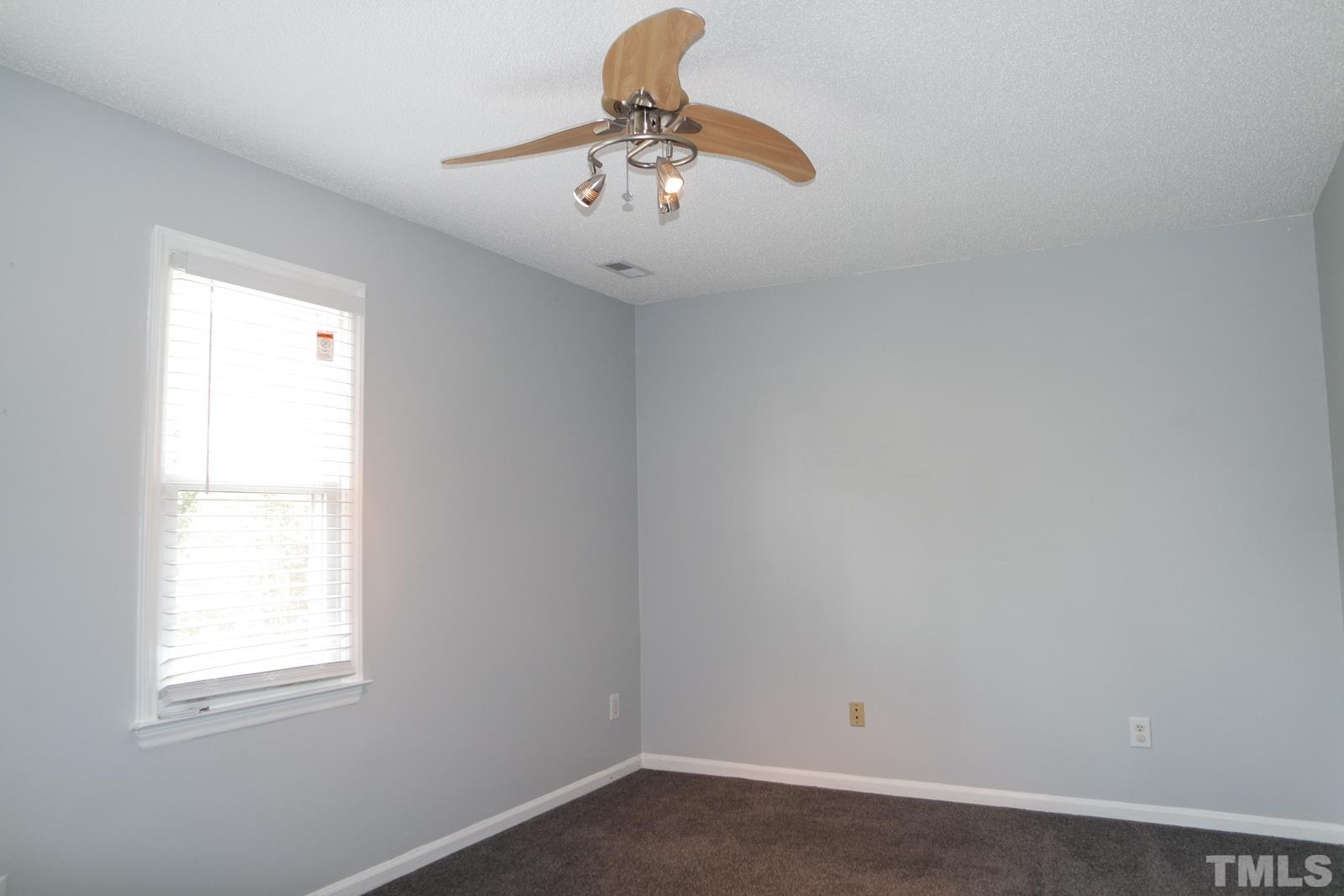 3800 Axle Lane Raleigh, NC 27616 - Photo 10 of 11 an empty room with a window