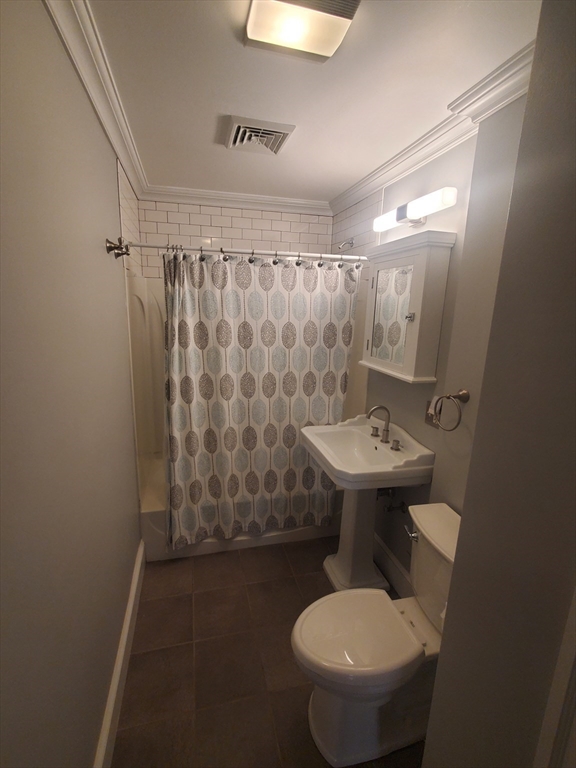 1 Grayson Street, Unit 2 Boston, MA 02124 - Photo 16 of 23 a bathroom with a sink toilet and shower