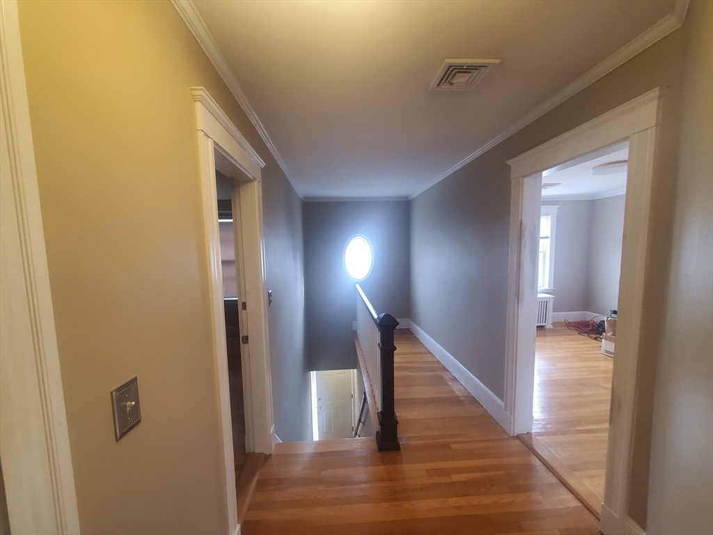 1 Grayson Street, Unit 2 Boston, MA 02124 - Photo 20 of 23 a view of entryway and hall with wooden floor