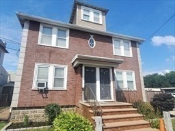 1 Grayson Street, Unit 2 Boston, MA 02124 - Photo 21 of 23 a front view of a house with a yard