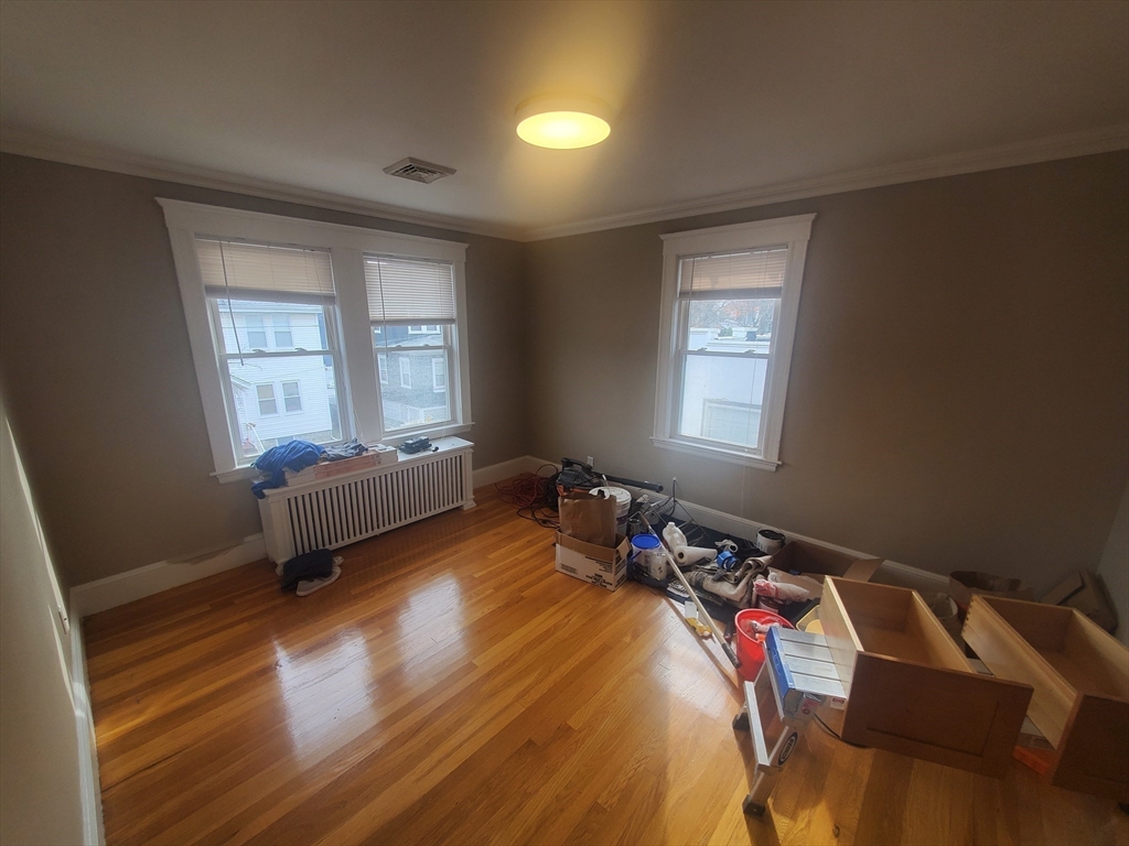 1 Grayson Street, Unit 2 Boston, MA 02124 - Photo 9 of 23 a bedroom with bed and a window