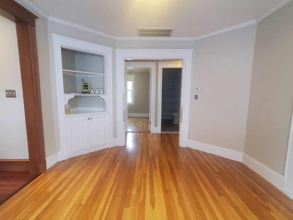 1 Grayson Street, Unit 2 Boston, MA 02124 - Photo 10 of 23 a view of hallway with wooden floor
