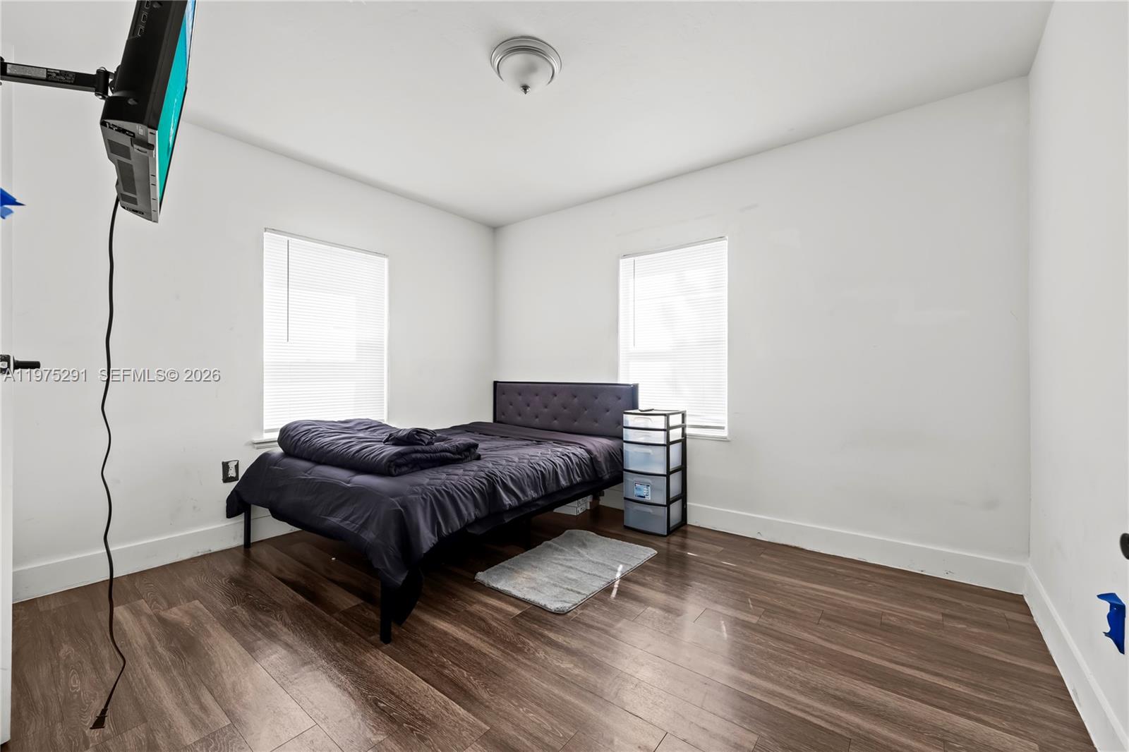 919 Northwest 66th Street Miami, FL 33150 - Photo 12 of 21 a living room with a couch and a wooden floor