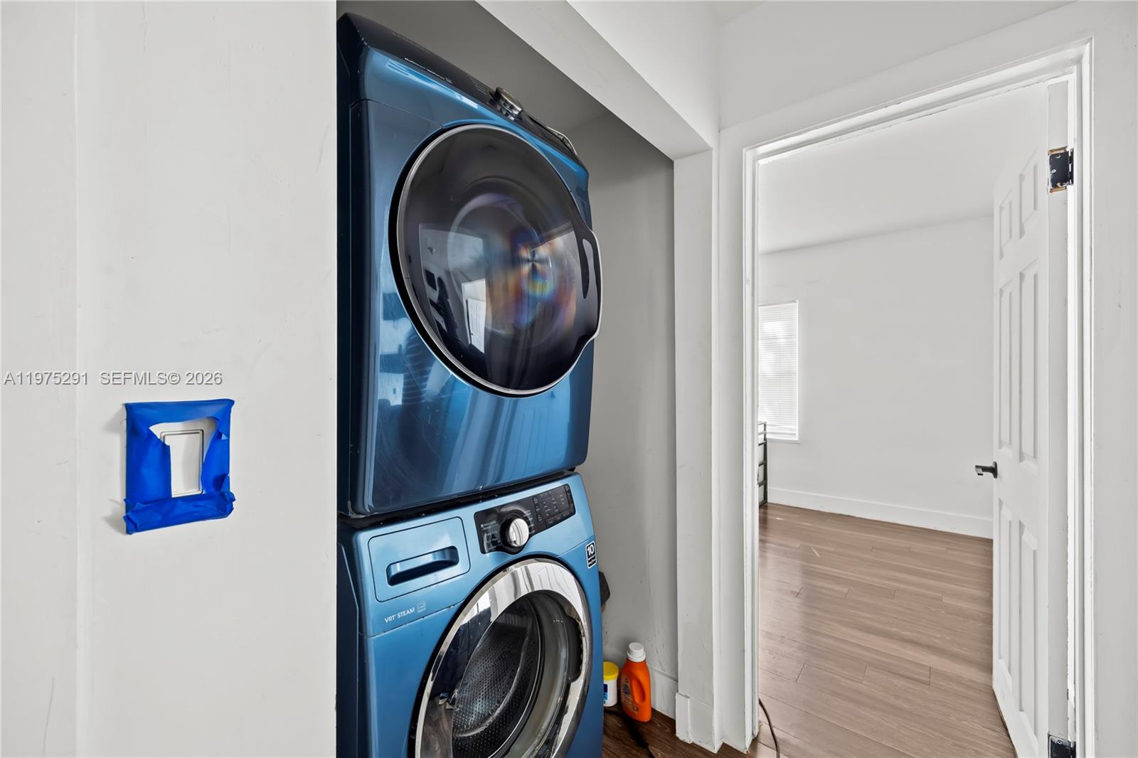 919 Northwest 66th Street Miami, FL 33150 - Photo 17 of 21 a view of a hallway with washer and dryer