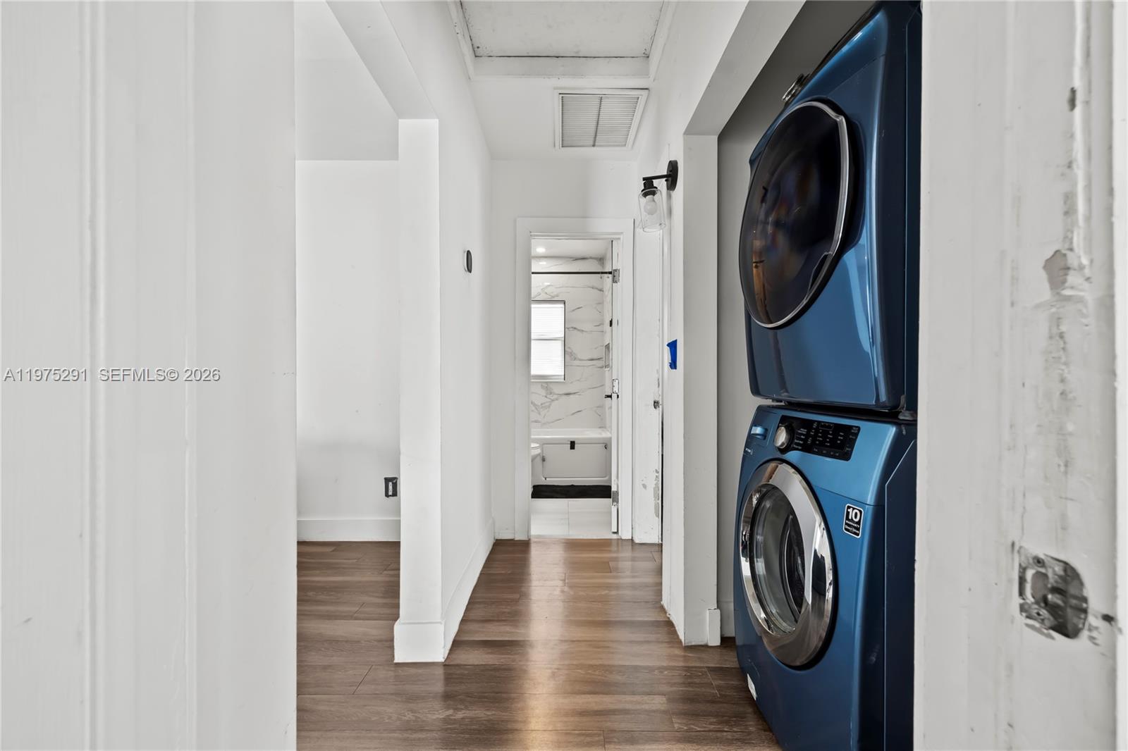 919 Northwest 66th Street Miami, FL 33150 - Photo 18 of 21 a view of a hallway with washer and dryer