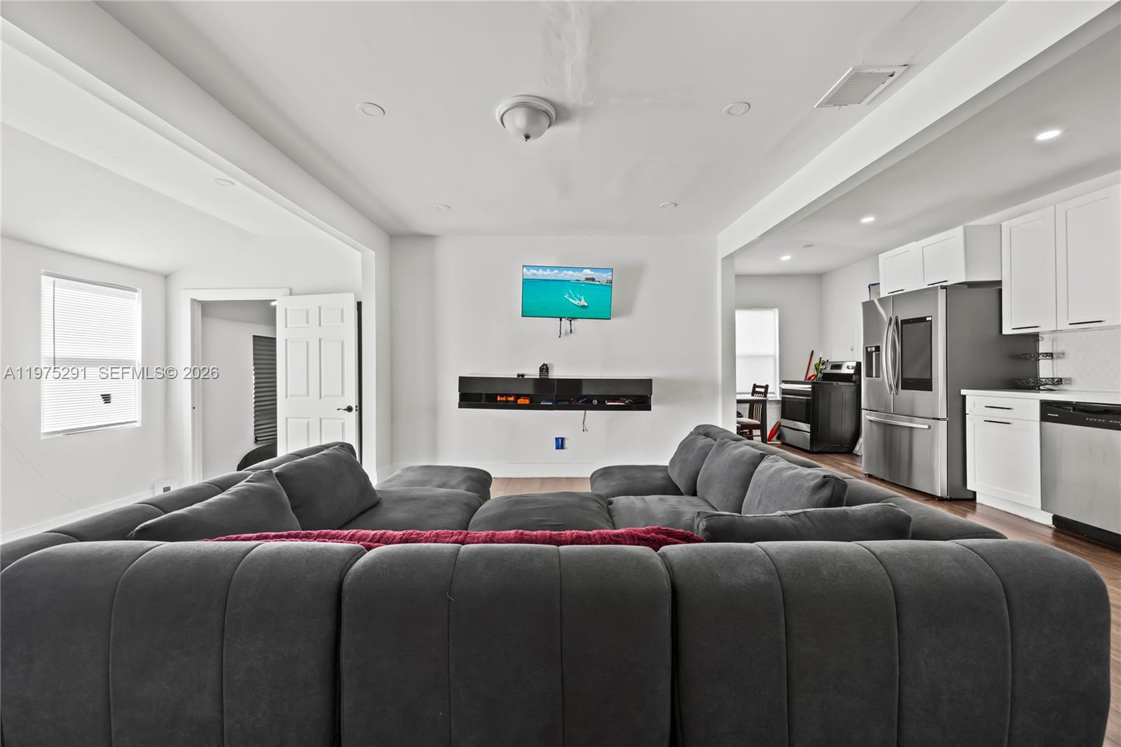 919 Northwest 66th Street Miami, FL 33150 - Photo 8 of 21 a living room with a bed furniture and kitchen view