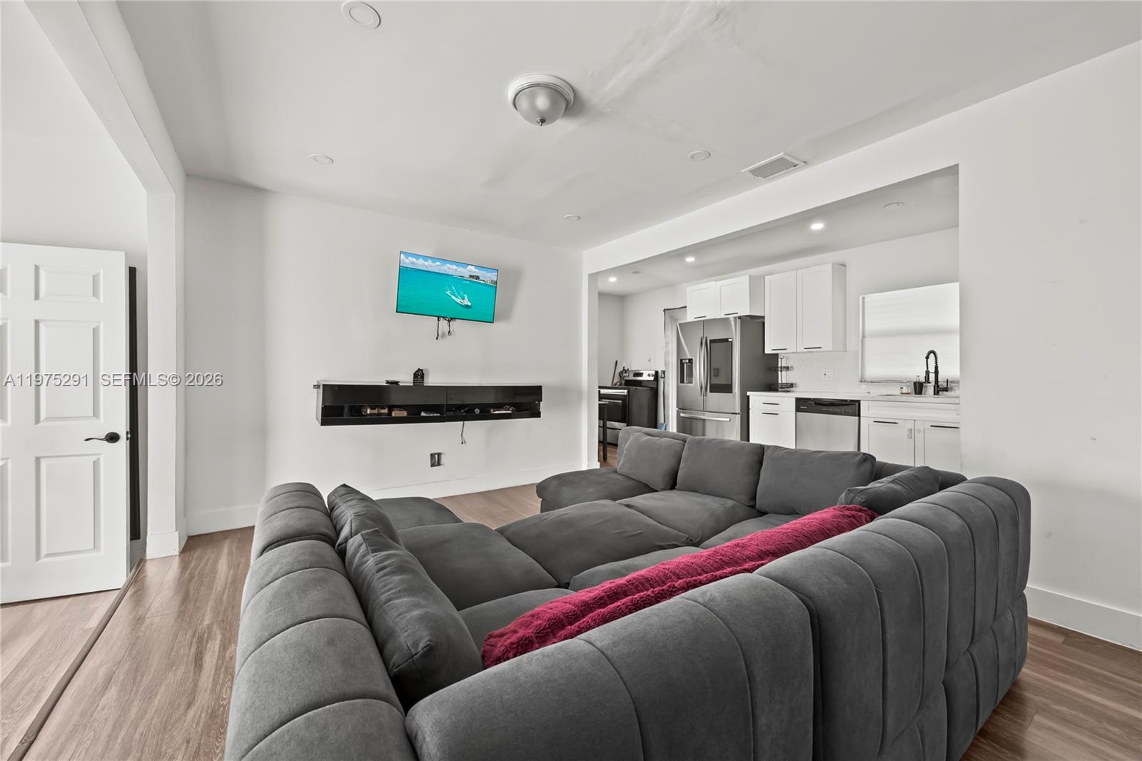 919 Northwest 66th Street Miami, FL 33150 - Photo 9 of 21 a living room with furniture and a wooden floor