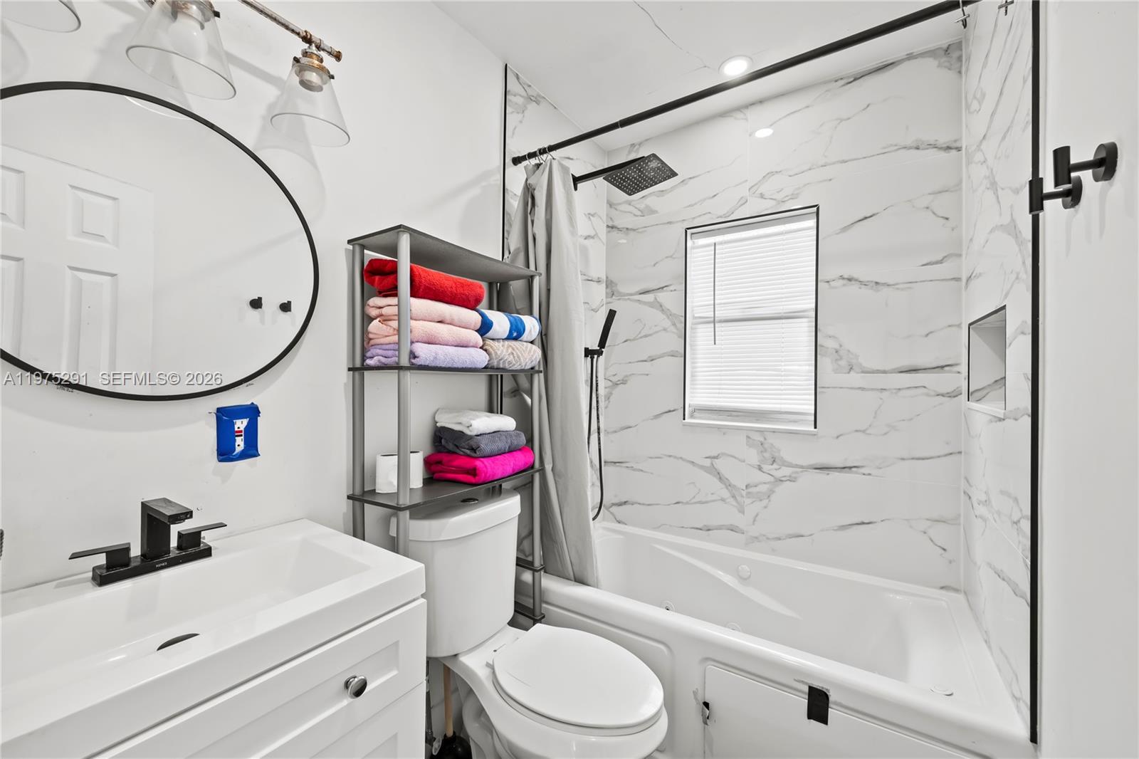 919 Northwest 66th Street Miami, FL 33150 - Photo 10 of 21 a bathroom with a sink toilet and shower