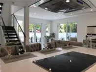 a view of a living room and entryway