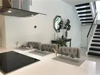 a kitchen with a sink and a stove