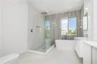 a bathroom with a bathtub and a shower