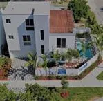 a aerial view of a house with a yard