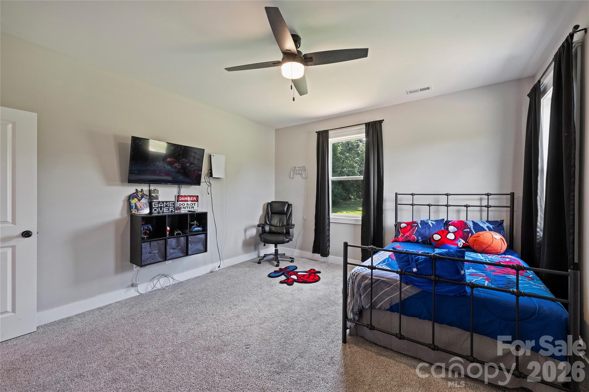 606 Elm Street Locust, NC 28097 - Photo 19 of 23 a living room with furniture and a flat screen tv