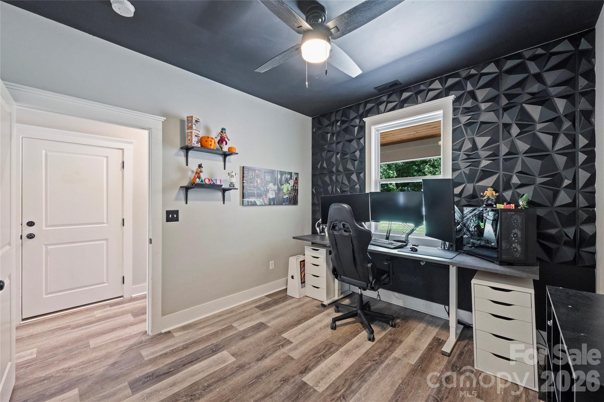 606 Elm Street Locust, NC 28097 - Photo 10 of 23 a view of a workspace with furniture and a window