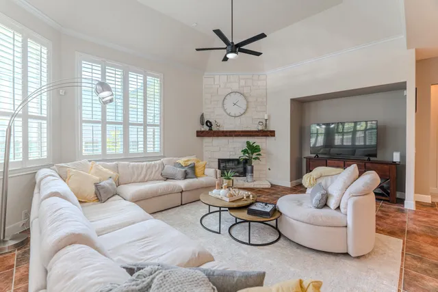 a living room with furniture and a large window