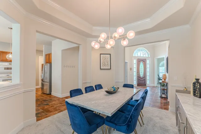 a kitchen with stainless steel appliances kitchen island granite countertop a sink and cabinets