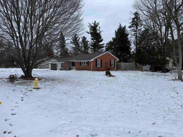 a house with trees in the background